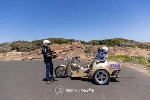 Two People Sit On A Trike With A Sidecar, Labeled 