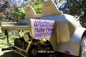 A Gold Trike With The Text 